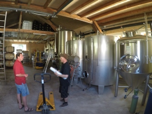 to the right once more. Raphael and Mike in front of the sour bottling line and the stainless fermentors